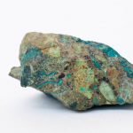copper ore from a copper mine in Chile, a green stone on a white background
